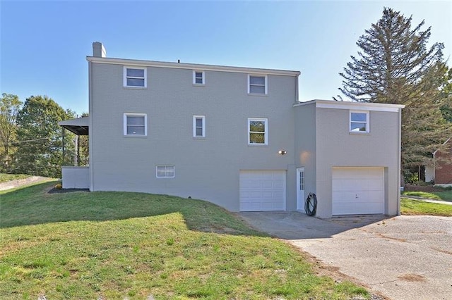 exterior space featuring a front yard and a garage