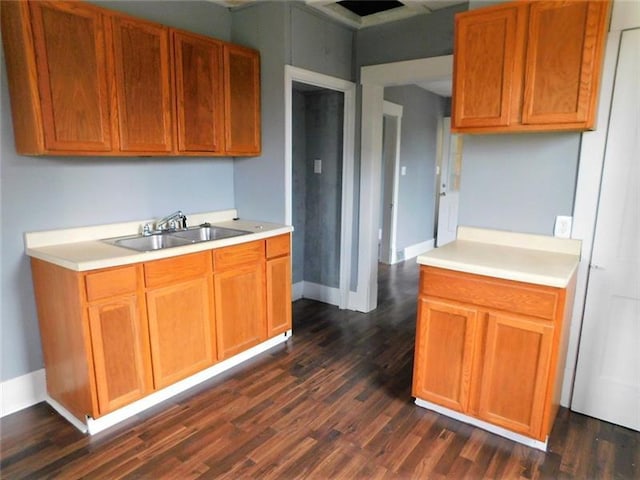 kitchen featuring sink and dark hardwood / wood-style flooring