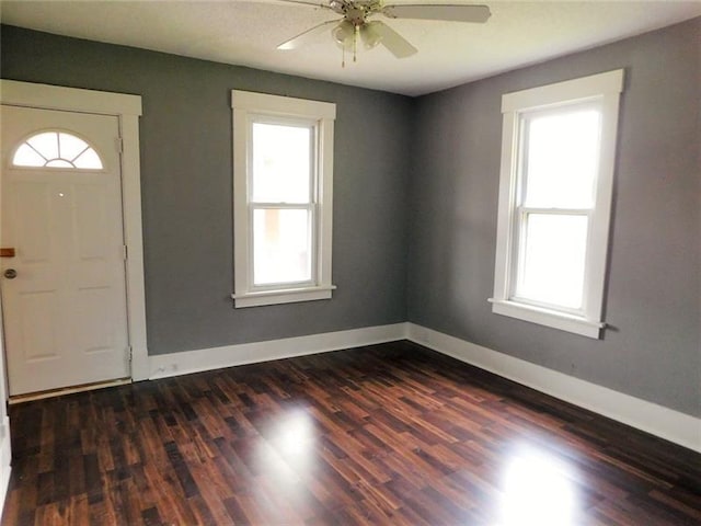 entrance foyer with dark hardwood / wood-style floors and ceiling fan