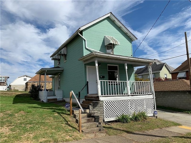 bungalow-style home with a porch and a front yard