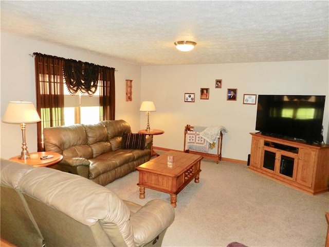 living room featuring light carpet and a textured ceiling