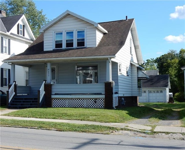 view of front facade featuring a porch and a garage