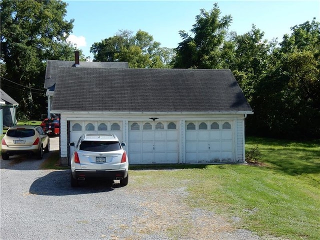 garage with a lawn