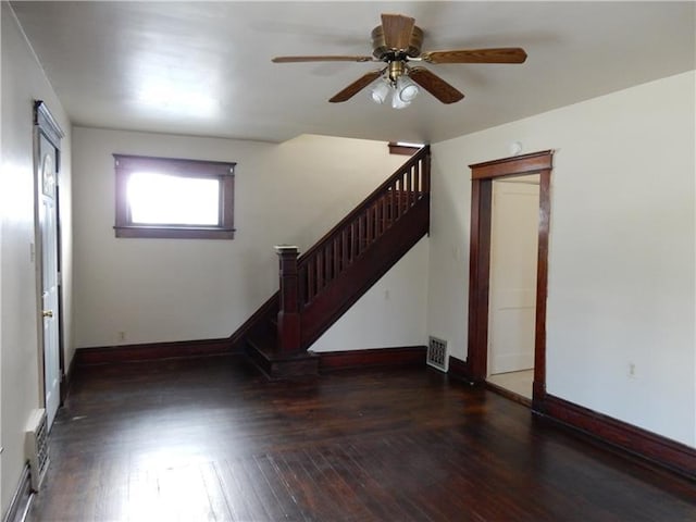 entryway with dark wood-type flooring and ceiling fan