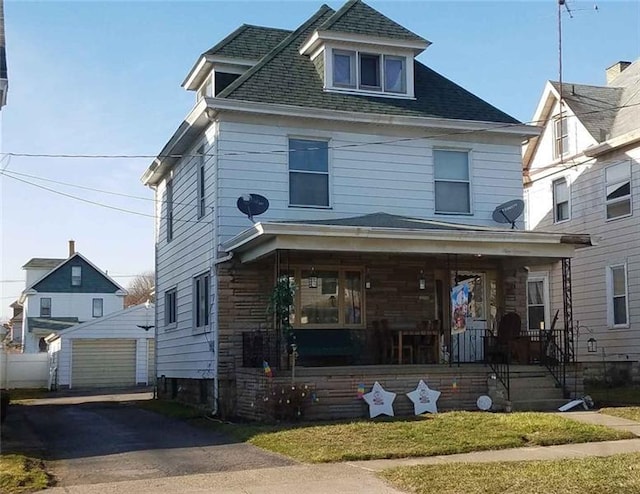 view of front of house with covered porch and a garage