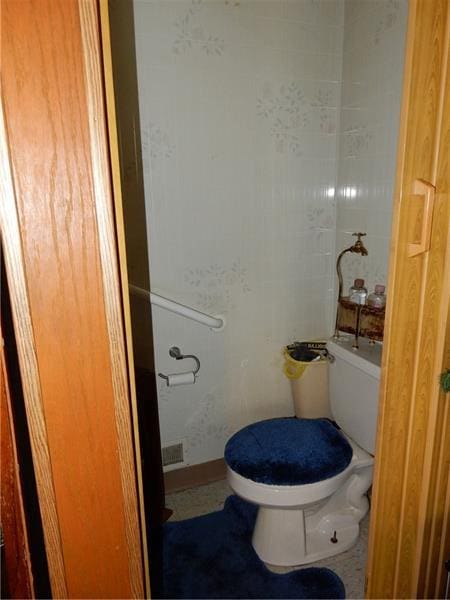 bathroom featuring toilet