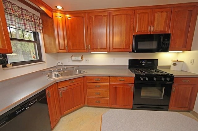 kitchen featuring sink, light tile floors, and black appliances