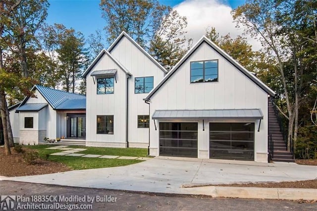 modern inspired farmhouse with a garage