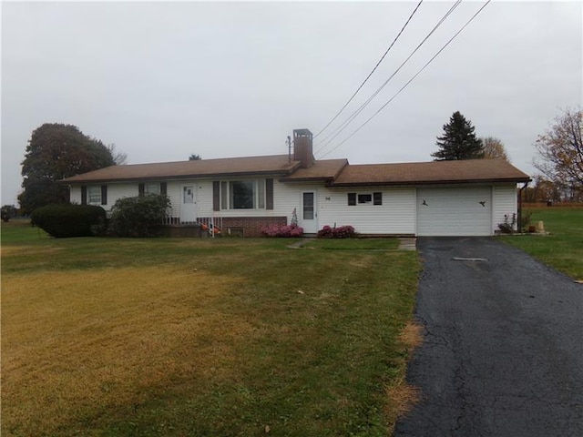 single story home featuring a front yard and a garage