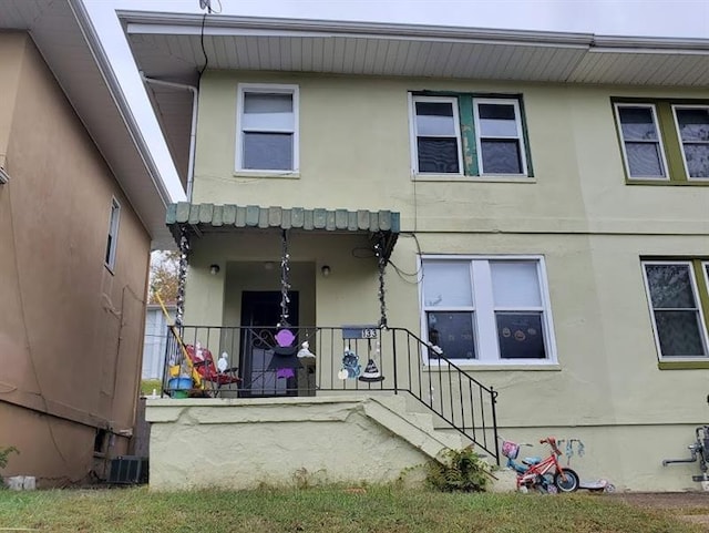 rear view of house with central AC