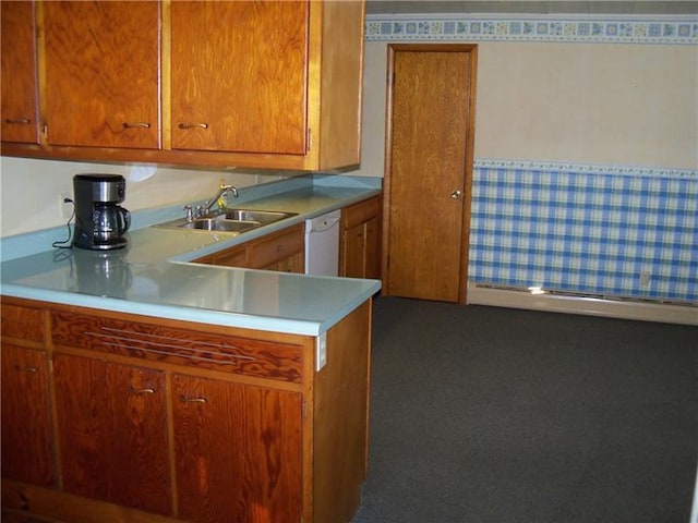 kitchen featuring sink, dark carpet, and dishwasher