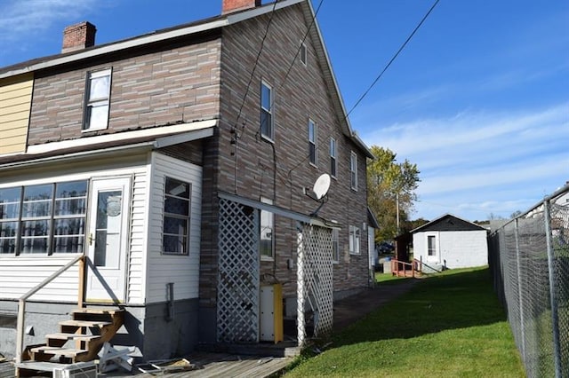 view of property exterior featuring a lawn