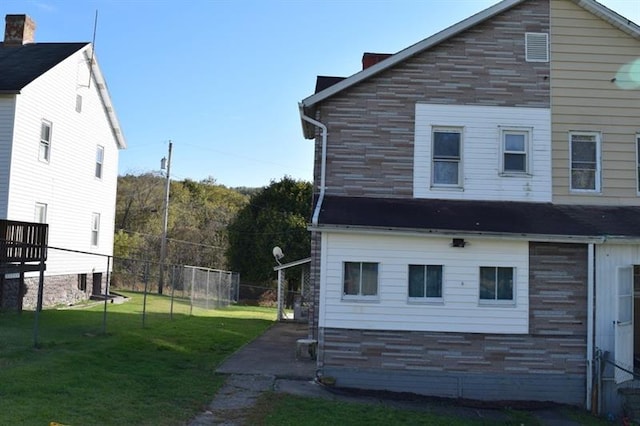 view of property exterior featuring a yard