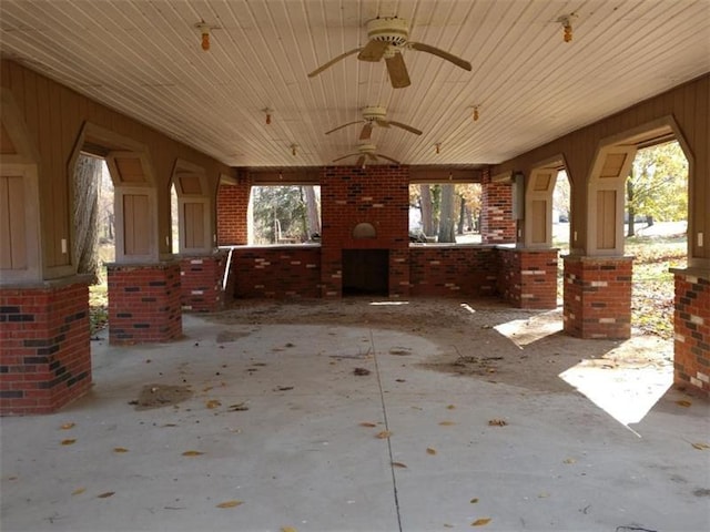 exterior space featuring ceiling fan