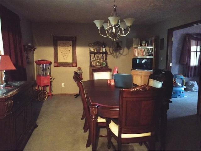 dining space with an inviting chandelier and carpet flooring