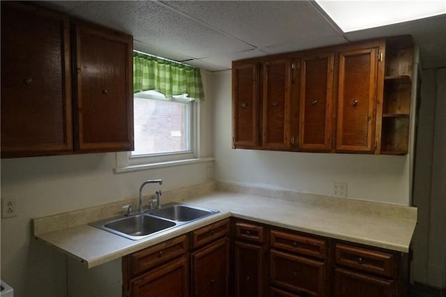 kitchen with sink and a paneled ceiling