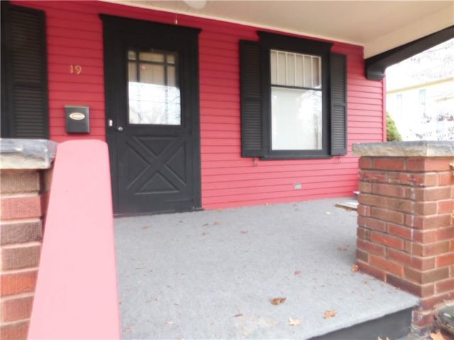 entrance to property with a porch