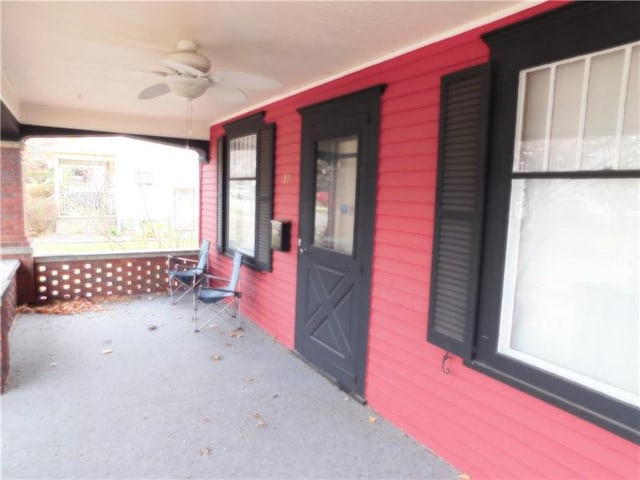 view of exterior entry with ceiling fan