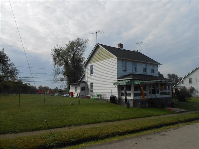 view of home's exterior with a yard