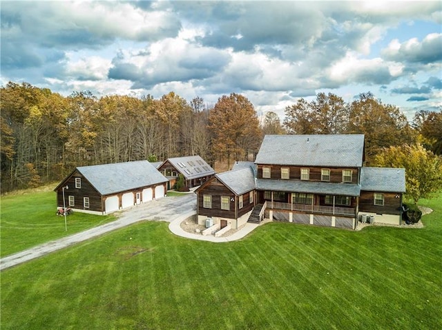 back of house featuring a lawn