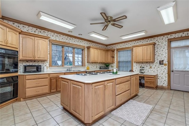 kitchen with a center island, ceiling fan, light tile floors, crown molding, and black appliances