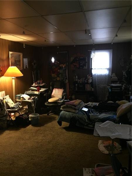 miscellaneous room featuring carpet flooring and a paneled ceiling