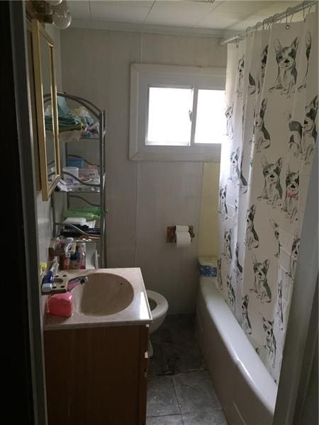 full bathroom featuring tile floors, toilet, shower / bath combo, and vanity