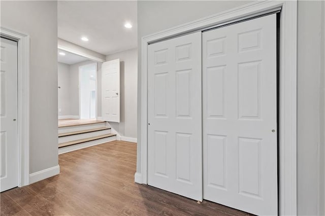 hallway with dark wood-type flooring