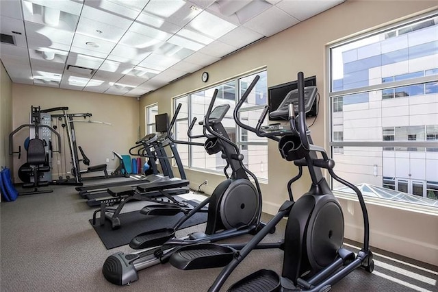 gym featuring a paneled ceiling