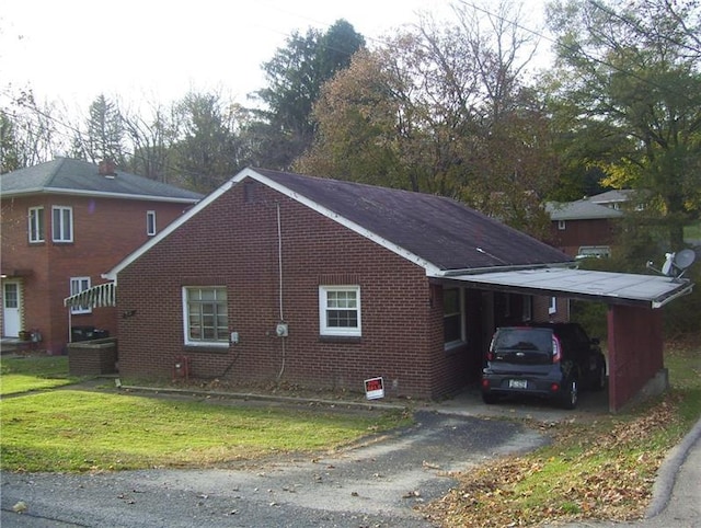 view of home's exterior with a carport