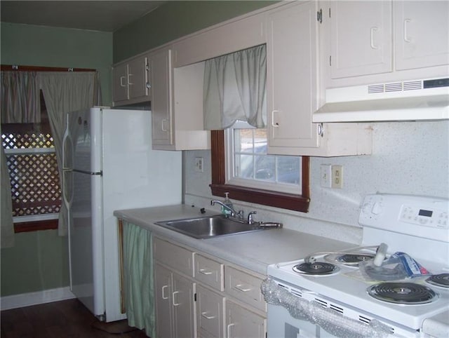 kitchen with white cabinets, sink, and white range with electric stovetop