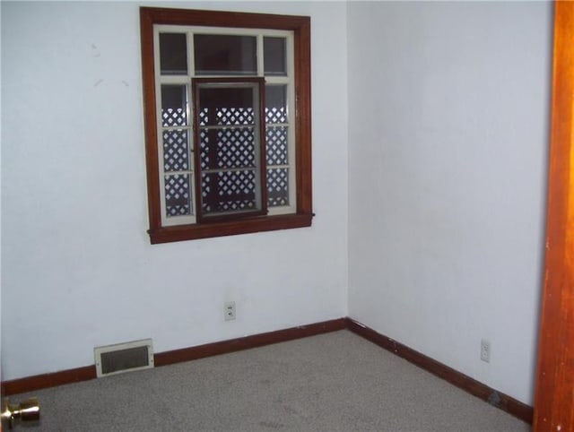 view of carpeted spare room