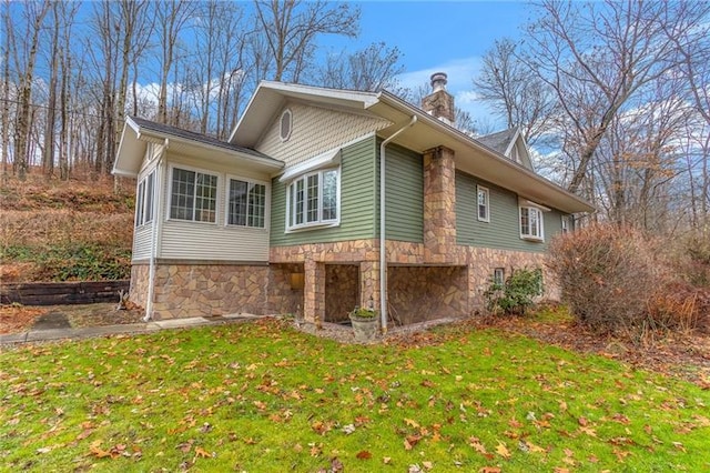 view of home's exterior featuring a yard