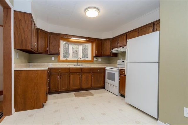 kitchen with white appliances, sink, and light tile floors