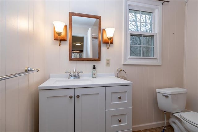 bathroom with toilet and vanity