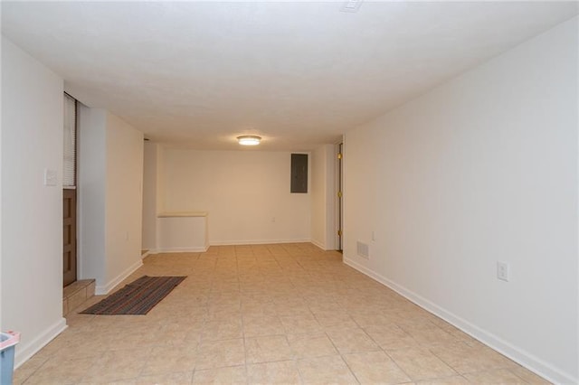 unfurnished room with light tile floors