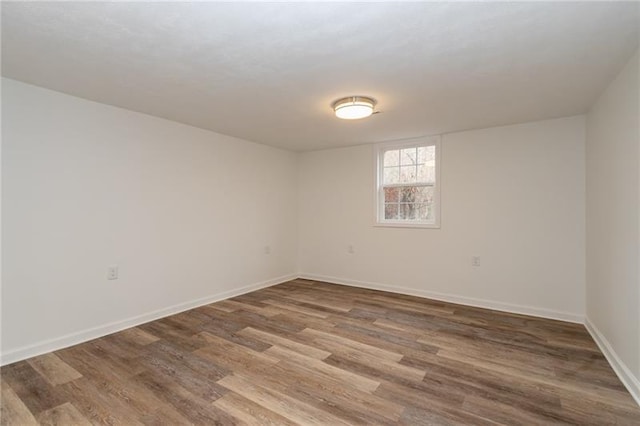 empty room with dark wood-type flooring