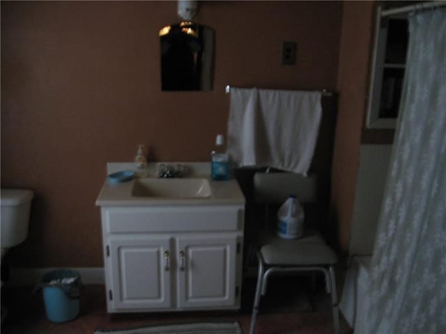 bathroom featuring toilet and vanity