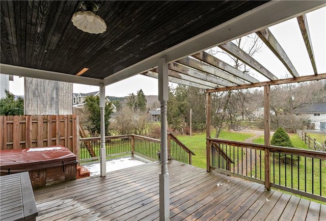 wooden deck featuring a lawn and a pergola