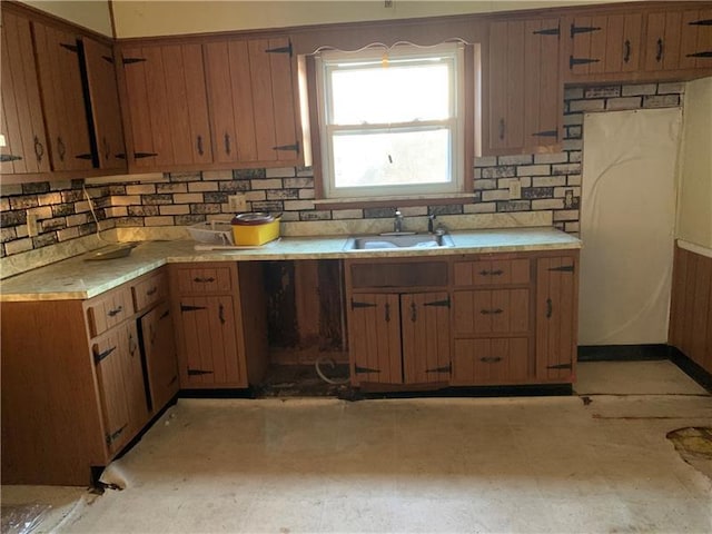 kitchen featuring backsplash and sink