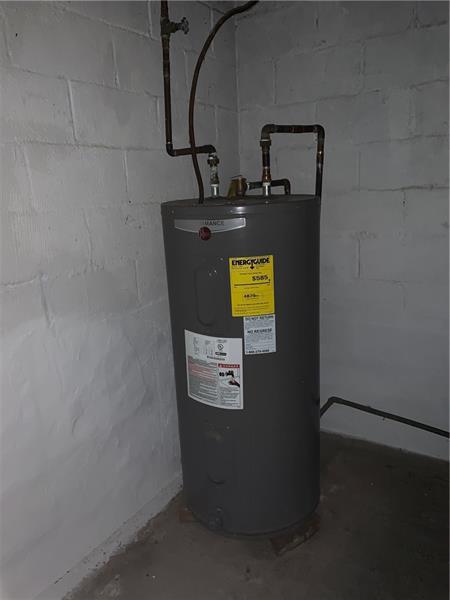 utility room with water heater