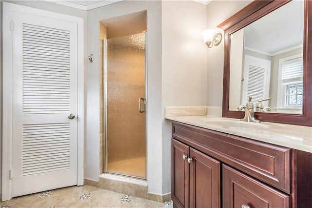 bathroom with a shower with door, tile flooring, ornamental molding, and vanity