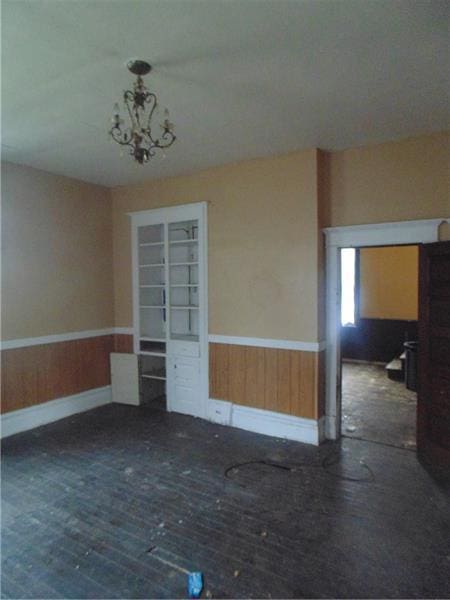 empty room featuring a chandelier