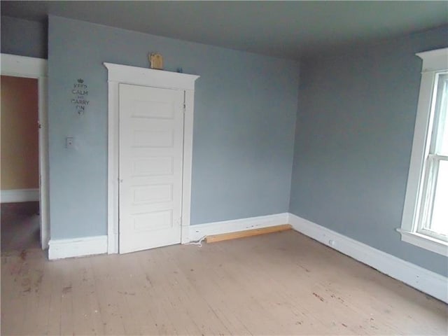 unfurnished bedroom featuring hardwood / wood-style floors