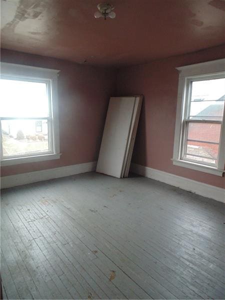 empty room with light hardwood / wood-style floors