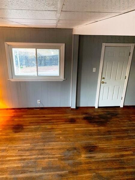 unfurnished room featuring dark hardwood / wood-style floors