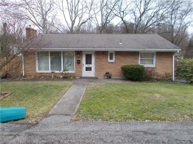 single story home with a front yard