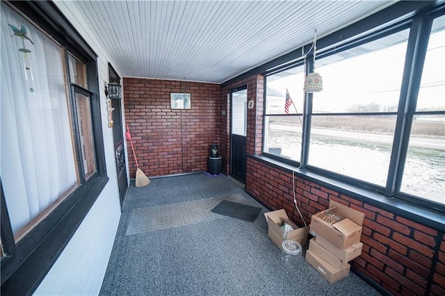 unfurnished sunroom featuring a wealth of natural light