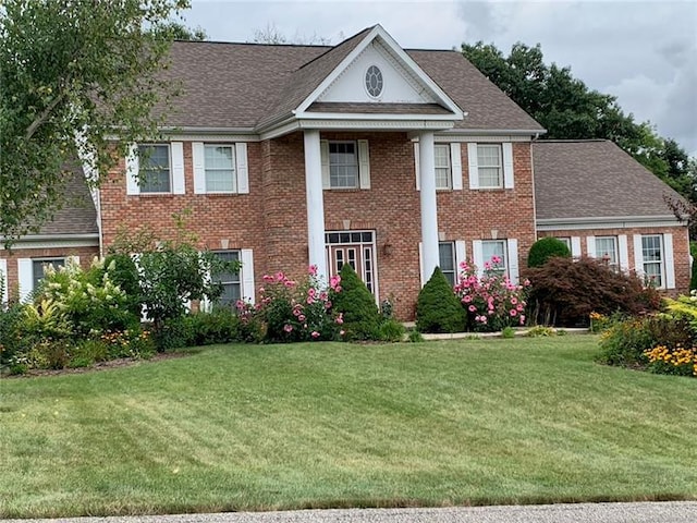 neoclassical / greek revival house with a front yard