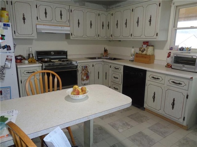 kitchen with dishwasher, sink, light tile flooring, and electric range